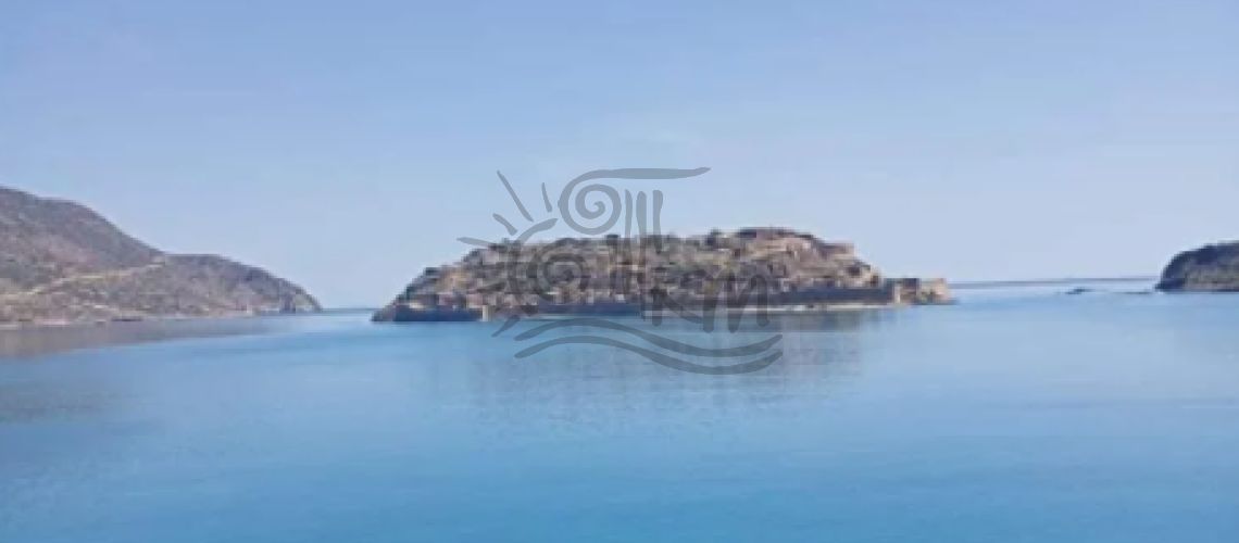 Lasithi. Agios Nikolaos Plaka. Land for sale by the sea 4,458 sq.m. with stunning views of the sea. property first image